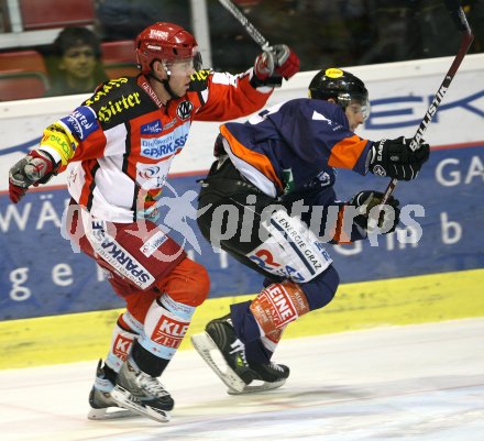 Eishockey Bundesliga. KAC gegen Graz 99ers. Jeremy Rebek (KAC), Greg Day (Graz). Klagenfurt, am 14.1.2007.
Foto: Kuess
---
pressefotos, pressefotografie, kuess, qs, qspictures, sport, bild, bilder, bilddatenbank