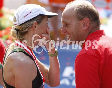 Ironman Austria. Schwimmen, Radfahren, Laufen. Siegerin Sandra Wallenhorst (GER) mit Stefan Petschnig. Klagenfurt, am 13.7.2008.
Copyright Kuess

---
pressefotos, pressefotografie, kuess, qs, qspictures, sport, bild, bilder, bilddatenbank