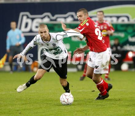 Fussball. Tipp3-Bundesliga. SK Austria Kelag Kaernten  gegen Cashpoint SCR Altach. Wolf Patrick (Austria Kaernten), Moedim Junior Jose Elias (Altach). Klagenfurt, 12.11.2008. 
Copyright Kuess

---
pressefotos, pressefotografie, kuess, qs, qspictures, sport, bild, bilder, bilddatenbank