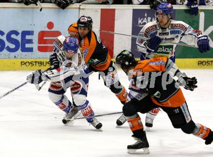 EBEL. Eishockey Bundesliga. EC Pasut VSV gegen Graz 99ers. Nikolas Petrik, Jonathan Ferland (VSV), Anthony Iob (Graz). Villach, am 9.12.2008.
Foto: Nadja Kuess



---
pressefotos, pressefotografie, kuess, qs, qspictures, sport, bild, bilder, bilddatenbank