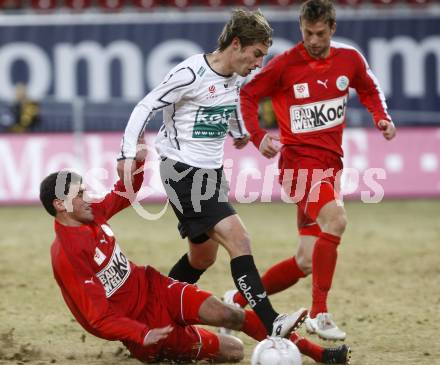 Fussball. Tipp3-Bundesliga. SK Austria Kelag Kaernten  gegen SV Mattersburg. Marc Sand, (Austria Kaernten), Adnan Mravac (Mattersburg). Klagenfurt, 28.2.2009. 
Foto: Kuess

---
pressefotos, pressefotografie, kuess, qs, qspictures, sport, bild, bilder, bilddatenbank