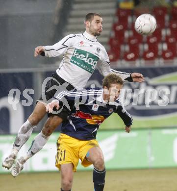 Fussball. Tipp3-Bundesliga. SK Austria Kelag Kaernten  gegen RB Salzburg. Oliver Pusztai, (Austria Kaernten), Marc Janko (Salzburg). Klagenfurt, 4.3..2009. 
Foto: Kuess

---
pressefotos, pressefotografie, kuess, qs, qspictures, sport, bild, bilder, bilddatenbank