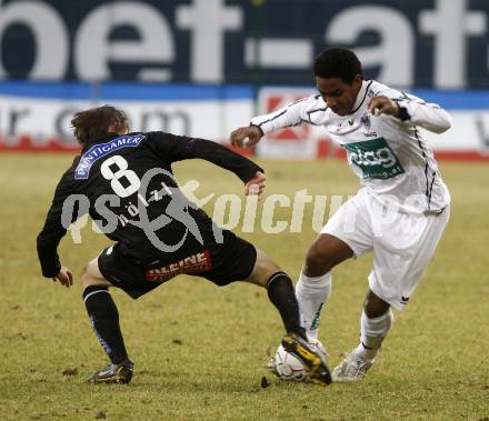 Fussball. Tipp3-Bundesliga. SK Austria Kelag Kaernten  gegen Sturm Graz. Sandro, (Austria Kaernten), Andreas Hoelzl (Graz). Klagenfurt, 18.3..2009. 
Foto: Kuess

---
pressefotos, pressefotografie, kuess, qs, qspictures, sport, bild, bilder, bilddatenbank