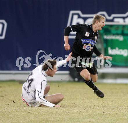 Fussball. Tipp3-Bundesliga. SK Austria Kelag Kaernten  gegen Sturm Graz. Schumacher, (Austria Kaernten), Mario Sonnleitner (Graz). Klagenfurt, 18.3..2009. 
Foto: Kuess

---
pressefotos, pressefotografie, kuess, qs, qspictures, sport, bild, bilder, bilddatenbank