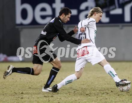 Fussball. Tipp3-Bundesliga. SK Austria Kelag Kaernten  gegen Sturm Graz. Stefan Hierlaender (Austria Kaernten), Shashiashvili George  (Graz). Klagenfurt, 18.3..2009. 
Foto: Kuess

---
pressefotos, pressefotografie, kuess, qs, qspictures, sport, bild, bilder, bilddatenbank