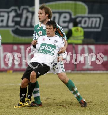 Fussball. Tipp3-Bundesliga. SK Austria Kelag Kaernten gegen SK Rapid. Zlatko Junuzovic, (Kaernten), Markus Heikkinen (Rapid). Klagenfurt, 21.3..2009. 
Foto: Kuess

---
pressefotos, pressefotografie, kuess, qs, qspictures, sport, bild, bilder, bilddatenbank