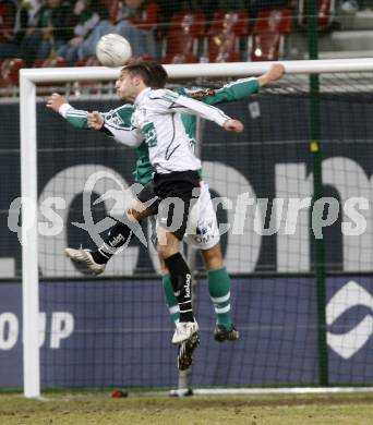 Fussball. Tipp3-Bundesliga. SK Austria Kelag Kaernten gegen SK Rapid. Oliver Pusztai, (Kaernten), Stefan Maierhofer (Rapid). Klagenfurt, 21.3..2009. 
Foto: Kuess

---
pressefotos, pressefotografie, kuess, qs, qspictures, sport, bild, bilder, bilddatenbank
