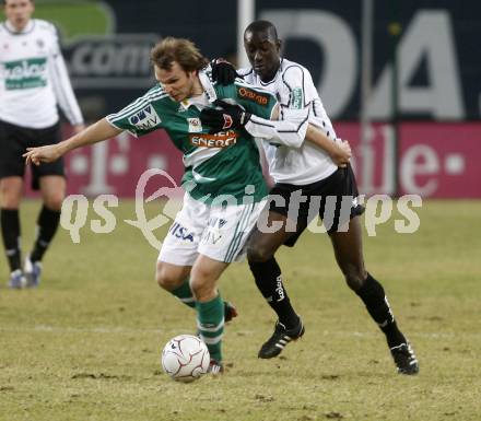 Fussball. Tipp3-Bundesliga. SK Austria Kelag Kaernten gegen SK Rapid. Modou Jagne, (Kaernten), Markus Heikkinen (Rapid). Klagenfurt, 21.3..2009. 
Foto: Kuess

---
pressefotos, pressefotografie, kuess, qs, qspictures, sport, bild, bilder, bilddatenbank