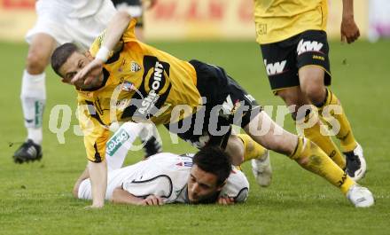 Fussball. Tipp3-Bundesliga. SK Austria Kelag Kaernten gegen SCR Altach. Markus Pink, (Austria Kaernten), Slavoljub Djordjevic (Altach). Klagenfurt, 25.4.2009. 
Foto: Kuess

---
pressefotos, pressefotografie, kuess, qs, qspictures, sport, bild, bilder, bilddatenbank