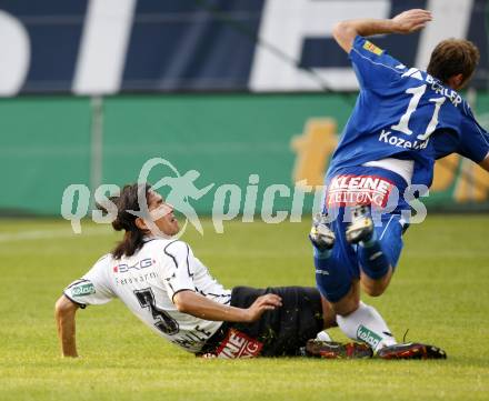 Fussball. Tipp3-Bundesliga. SK Austria Kelag Kaernten  gegen Kapfenberger SV. Carlos Chaile, (Austria Kaernten), Arno Paul Kozelski  (Kapfenberg). Klagenfurt, 9.5.2009. 
Foto: Kuess

---
pressefotos, pressefotografie, kuess, qs, qspictures, sport, bild, bilder, bilddatenbank