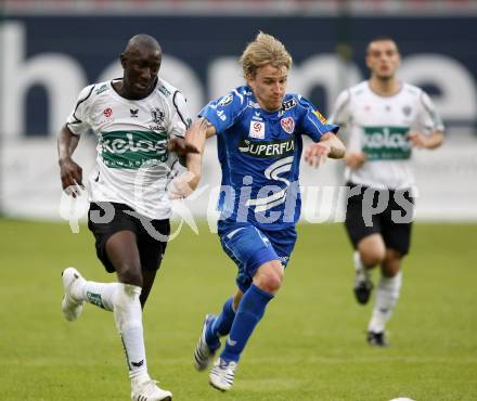 Fussball. Tipp3-Bundesliga. SK Austria Kelag Kaernten  gegen Kapfenberger SV. Modou Jagne, (Austria Kaernten), Markus Felfernig (Kapfenberg). Klagenfurt, 9.5.2009. 
Foto: Kuess

---
pressefotos, pressefotografie, kuess, qs, qspictures, sport, bild, bilder, bilddatenbank