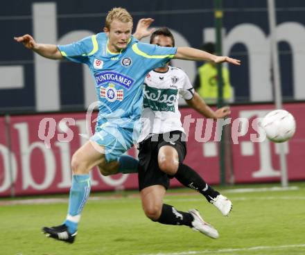 Fussball. Tipp3-Bundesliga. SK Austria Kelag Kaernten  gegen SK Sturm Graz. Andre Schembri,(Austria Kaernten),  Mario Sonnleitner (Graz). Klagenfurt, 9.8.2009 
Foto: Kuess

---
pressefotos, pressefotografie, kuess, qs, qspictures, sport, bild, bilder, bilddatenbank