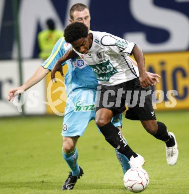 Fussball Bundesliga. SK Austria Kaernten gegen Sturm Graz. Sandro Ferreira Da Silva  (Kaernten), Ilia Kandelaki (Sturm Graz). Klagenfurt, am 9.8.2009.
Foto: Kuess
---
pressefotos, pressefotografie, kuess, qs, qspictures, sport, bild, bilder, bilddatenbank