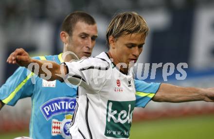 Fussball Bundesliga. SK Austria Kaernten gegen Sturm Graz. Stefan Hierlaender (Kaernten), Ilia Kandelaki (Sturm Graz). Klagenfurt, am 9.8.2009.
Foto: Kuess
---
pressefotos, pressefotografie, kuess, qs, qspictures, sport, bild, bilder, bilddatenbank