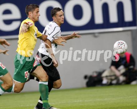 Fussball. Tipp3-Bundesliga. SK Austria Kelag Kaernten  gegen SV Josko Ried. Markus Pink, (Austria Kaernten), Martin Stocklasa (Ried). Klagenfurt, 21.8.2009. 
Foto: Kuess

---
pressefotos, pressefotografie, kuess, qs, qspictures, sport, bild, bilder, bilddatenbank