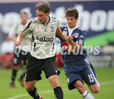 Fussball. Tipp3-Bundesliga. SK Austria Kelag Kaernten  gegen Red Bull Salzburg.  Marc Sand (Austria Kaernten), Franz Schiemer (Red Bull Salzburg). Klagenfurt, 26.9.2009. 
Foto: Kuess

---
pressefotos, pressefotografie, kuess, qs, qspictures, sport, bild, bilder, bilddatenbank