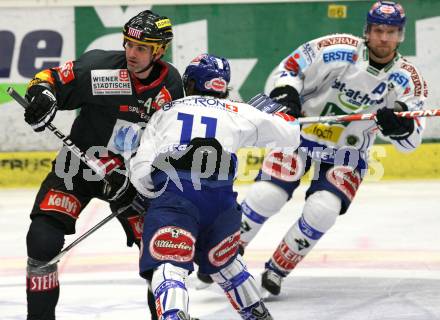 EBEL. Eishockey Bundesliga. EC Pasut VSV gegen Vienna Capitals.  Nico Toff, (VSV), Sean Selmser (Caps). Villach, am 18.10.2009.
Foto: Kuess 


---
pressefotos, pressefotografie, kuess, qs, qspictures, sport, bild, bilder, bilddatenbank