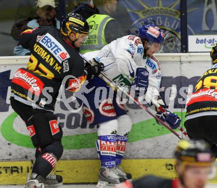 EBEL. Eishockey Bundesliga. EC Pasut VSV gegen Vienna Capitals.  Christian Ban,(VSV),  Marcel Rodman (Caps). Villach, am 18.10.2009.
Foto: Kuess 


---
pressefotos, pressefotografie, kuess, qs, qspictures, sport, bild, bilder, bilddatenbank