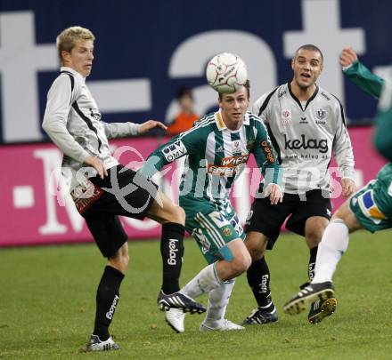 Fussball. Tipp3-Bundesliga. SK Austria Kelag Kaernten gegen Rapid Wien.  Thomas Hinum, Marco Salvatore, (Austria Kaernten), Rene Gartler (Rapid). Klagenfurt, 28.10.2009.
Foto: Kuess  

---
pressefotos, pressefotografie, kuess, qs, qspictures, sport, bild, bilder, bilddatenbank