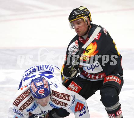 EBEL. Eishockey Bundesliga. EC Pasut VSV gegen Vienna Capitals.  Mikael Wahlberg (VSV), Benoit Gratton (Caps). Villach, am 30.10.2009.
Foto: Kuess 


---
pressefotos, pressefotografie, kuess, qs, qspictures, sport, bild, bilder, bilddatenbank