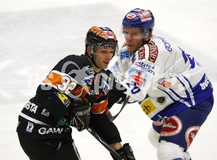 EBEL. Eishockey Bundesliga. EC Pasut VSV gegen Graz 99ers. Mickey Elick (VSV), Jean Philippe Pare (Graz). Villach, am 17.11.2009.
Foto: Kuess 


---
pressefotos, pressefotografie, kuess, qs, qspictures, sport, bild, bilder, bilddatenbank