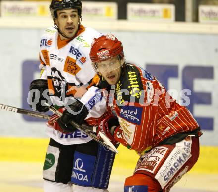 EBEL. Eishockey Bundesliga. KAC gegen  Graz 99ers.  Johannes Kirisits (KAC),  Warren Norris (Graz). Klagenfurt, am 1.1.2010.
Foto: Kuess 

---
pressefotos, pressefotografie, kuess, qs, qspictures, sport, bild, bilder, bilddatenbank