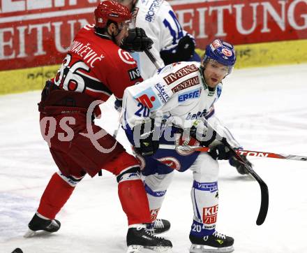 EBEL. Eishockey Bundesliga. EC Pasut VSV gegen HK Acroni Jesenice.  Mickey Elick (VSV), Sabahudin Kovacevic (Jesenice). Villach, am 3.1.2010.
Foto: Kuess 


---
pressefotos, pressefotografie, kuess, qs, qspictures, sport, bild, bilder, bilddatenbank