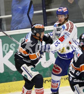 EBEL. Eishockey Bundesliga. EC Pasut VSV gegen Graz 99ers. Philipp Pinter,  (VSV), Warren Norris (Graz). Villach, am 15.1.2010.
Foto: Kuess 


---
pressefotos, pressefotografie, kuess, qs, qspictures, sport, bild, bilder, bilddatenbank