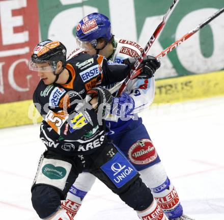 EBEL. Eishockey Bundesliga. EC Pasut VSV gegen Graz 99ers. Stefan Bacher, (VSV),  Matthias Schwab (Graz). Villach, am 15.1.2010.
Foto: Kuess 


---
pressefotos, pressefotografie, kuess, qs, qspictures, sport, bild, bilder, bilddatenbank