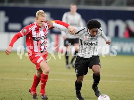 Fussball. Tipp3-Bundesliga. SK Austria Kelag Kaernten  gegen KSV Superfund Kapfenberger SV. Sandro Ferreira Da Silva, (Austria Kaernten), Manuel Schmid (Kapfenberg). Klagenfurt, 27.2.2010. 
Foto: Kuess

---
pressefotos, pressefotografie, kuess, qs, qspictures, sport, bild, bilder, bilddatenbank