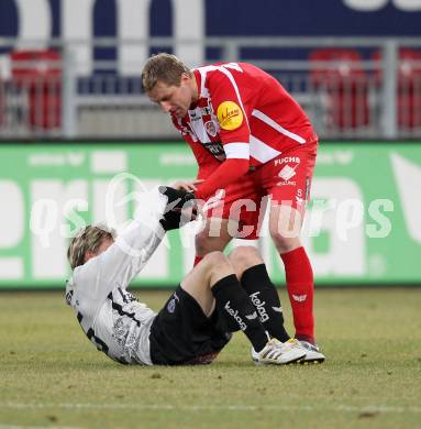 Fussball. Tipp3-Bundesliga. SK Austria Kelag Kaernten  gegen KSV Superfund Kapfenberger SV. Stefan Hierlaender,  (Austria Kaernten), Milan Fukal (Kapfenberg). Klagenfurt, 27.2.2010. 
Foto: Kuess

---
pressefotos, pressefotografie, kuess, qs, qspictures, sport, bild, bilder, bilddatenbank