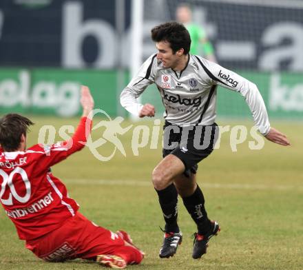 Fussball. Tipp3-Bundesliga. SK Austria Kelag Kaernten  gegen KSV Superfund Kapfenberger SV. Goran Aleksic (Austria Kaernten), Boris Huettenbrenner (Kapfenberg). Klagenfurt, 27.2.2010. 
Foto: Kuess

---
pressefotos, pressefotografie, kuess, qs, qspictures, sport, bild, bilder, bilddatenbank