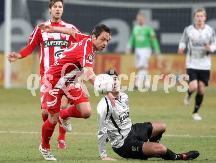 Fussball. Tipp3-Bundesliga. SK Austria Kelag Kaernten  gegen KSV Superfund Kapfenberger SV. Goran Aleksic (Austria Kaernten), Andreas Rauscher (Kapfenberg). Klagenfurt, 27.2.2010. 
Foto: Kuess

---
pressefotos, pressefotografie, kuess, qs, qspictures, sport, bild, bilder, bilddatenbank