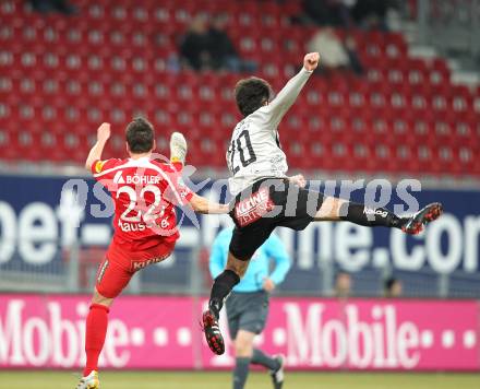 Fussball. Tipp3-Bundesliga. SK Austria Kelag Kaernten  gegen KSV Superfund Kapfenberger SV. Goran Aleksic (Austria Kaernten), Andreas Rauscher (Kapfenberg). Klagenfurt, 27.2.2010. 
Foto: Kuess

---
pressefotos, pressefotografie, kuess, qs, qspictures, sport, bild, bilder, bilddatenbank