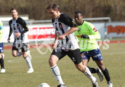 Fussball. Regionalliga. WAC/St. Andrae gegen SV Bad Aussee. Marco Reich (WAC/St. Andrae),  Jean Claude Boyokino (Bad Aussee). Wolfsberg, 13.3.2010. 
Foto: Kuess

---
pressefotos, pressefotografie, kuess, qs, qspictures, sport, bild, bilder, bilddatenbank