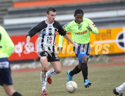 Fussball. Regionalliga. WAC/St. Andrae gegen SV Bad Aussee.  Devid Stanislavjevic (WAC/St. Andrae),  Oliver Teguia (Bad Aussee). Wolfsberg, 13.3.2010. 
Foto: Kuess

---
pressefotos, pressefotografie, kuess, qs, qspictures, sport, bild, bilder, bilddatenbank