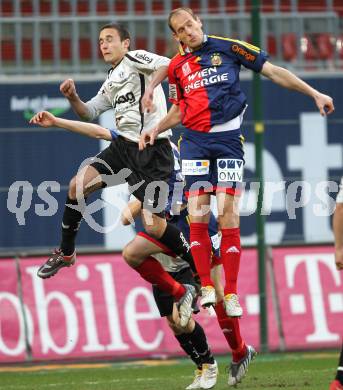 Fussball Bundesliga. SK Austria Kaernten gegen SK Rapid Wien. Markus Pink (Kaernten), Juergen Patocka (Rapid). Klagenfurt, am 27.3.2010.
Foto: Kuess
---
pressefotos, pressefotografie, kuess, qs, qspictures, sport, bild, bilder, bilddatenbank