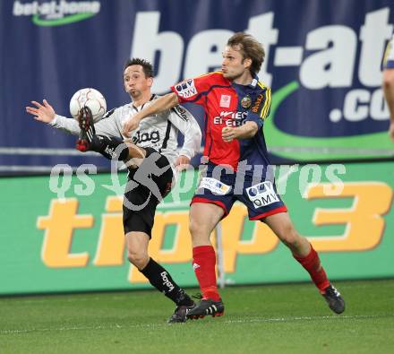 Fussball Bundesliga. SK Austria Kaernten gegen SK Rapid Wien. Matthias Dollinger (Kaernten), Markus Heikkinen (Rapid). Klagenfurt, am 27.3.2010.
Foto: Kuess
---
pressefotos, pressefotografie, kuess, qs, qspictures, sport, bild, bilder, bilddatenbank