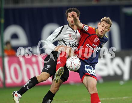 Fussball Bundesliga. SK Austria Kaernten gegen SK Rapid Wien. Branko Elsner (Kaernten), Nikica Jelavic (Rapid). Klagenfurt, am 27.3.2010.
Foto: Kuess
---
pressefotos, pressefotografie, kuess, qs, qspictures, sport, bild, bilder, bilddatenbank