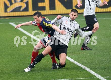 Fussball. OEFB Stiegl Cup. SK Austria Kelag Kaernten  gegen Rapid Wien. Oliver Pusztai, (Austria Kaernten), Christopher Drazan (Rapid Wien). Klagenfurt, 31.3.2010. 
Foto: Kuess

---
pressefotos, pressefotografie, kuess, qs, qspictures, sport, bild, bilder, bilddatenbank