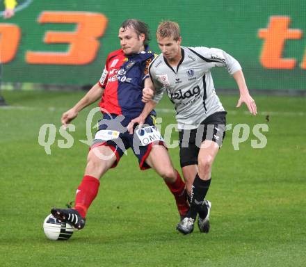 Fussball. OEFB Stiegl Cup. SK Austria Kelag Kaernten  gegen Rapid Wien. Thomas Hinum (Austria Kaernten), Markus Heikkinen (Rapid Wien). Klagenfurt, 31.3.2010. 
Foto: Kuess

---
pressefotos, pressefotografie, kuess, qs, qspictures, sport, bild, bilder, bilddatenbank