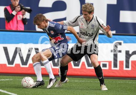 Fussball. Bundesliga. SK Austria Kelag Kaernten  gegen Red Bull Salzburg. Michael Sollbauer, (Austria Kaernten), Dusan Svento (Salzburg). Klagenfurt, 10.4.2010. 
Foto: Kuess

---
pressefotos, pressefotografie, kuess, qs, qspictures, sport, bild, bilder, bilddatenbank
