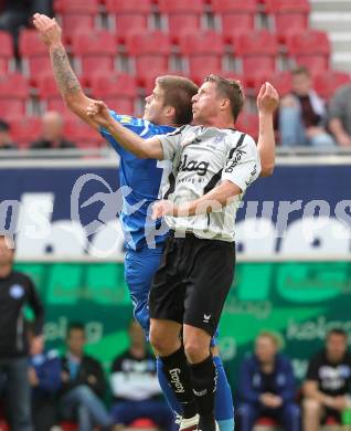 Fussball. Tipp3-Bundesliga. SK Austria Kaernten gegen SC Magna Wiener Neustadt. Thomas Riedl, (Austria Kaernten), Thomas Helly (Wr. Neustadt). Klagenfurt, 13.5.2010. 
Foto: Kuess 

---
pressefotos, pressefotografie, kuess, qs, qspictures, sport, bild, bilder, bilddatenbank