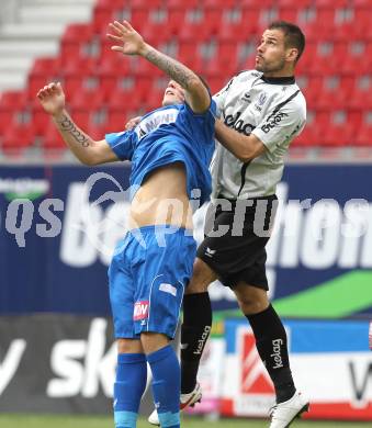 Fussball. Tipp3-Bundesliga. SK Austria Kaernten gegen SC Magna Wiener Neustadt. Oliver Pusztai (Austria Kaernten), Thomas Helly (Wr. Neustadt). Klagenfurt, 13.5.2010. 
Foto: Kuess 

---
pressefotos, pressefotografie, kuess, qs, qspictures, sport, bild, bilder, bilddatenbank