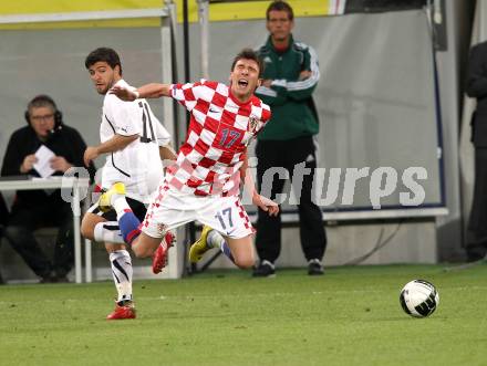 Fussball. Laenderspiel Oesterreich gegen Kroatien. Uemit Korkmaz, (Oesterreich), Mario Mandzukic (Kroatien). Klagenfurt, 19.5.2010. 
Foto: Kuess 

---
pressefotos, pressefotografie, kuess, qs, qspictures, sport, bild, bilder, bilddatenbank