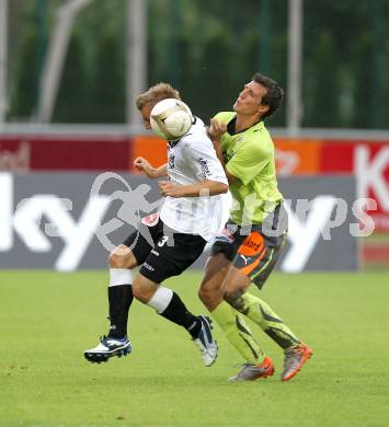 Fussball. Erste Liga. WAC/St. Andrae gegen FC PAX Gratkorn. Manuel Kerhe (WAC), Perchtold Marco (Gratkorn).  Wolfsberg, 13.7.2010. 
Foto: Kuess

---
pressefotos, pressefotografie, kuess, qs, qspictures, sport, bild, bilder, bilddatenbank