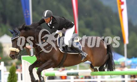 Springreiten. Kaerntner Meisterschaften. Ulrich Domaingo auf Darkness Delight. Treffen, am 18.7.2010.
Foto: Kuess
---
pressefotos, pressefotografie, kuess, qs, qspictures, sport, bild, bilder, bilddatenbank