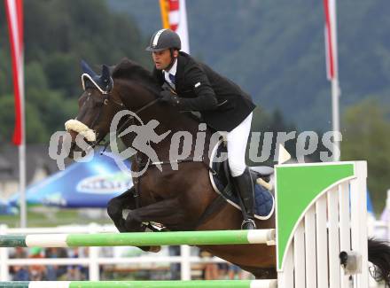 Springreiten. Kaerntner Meisterschaften. Ulrich Domaingo auf Darkness Delight. Treffen, am 18.7.2010.
Foto: Kuess
---
pressefotos, pressefotografie, kuess, qs, qspictures, sport, bild, bilder, bilddatenbank