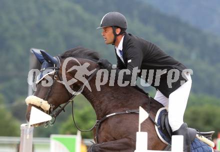 Springreiten. Kaerntner Meisterschaften. Ulrich Domaingo auf Darkness Delight. Treffen, am 18.7.2010.
Foto: Kuess
---
pressefotos, pressefotografie, kuess, qs, qspictures, sport, bild, bilder, bilddatenbank