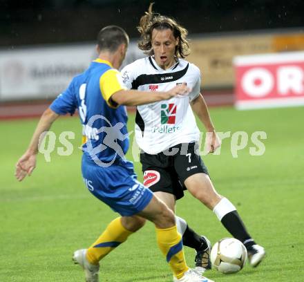 Fussball. Erste Liga. WAC/St. Andrae gegen Vienna FC. Dario Baldauf,  (WAC), Marko Milutinovic (Vienna).  Wolfsberg, 23.7.2010. 
Foto: Kuess

---
pressefotos, pressefotografie, kuess, qs, qspictures, sport, bild, bilder, bilddatenbank